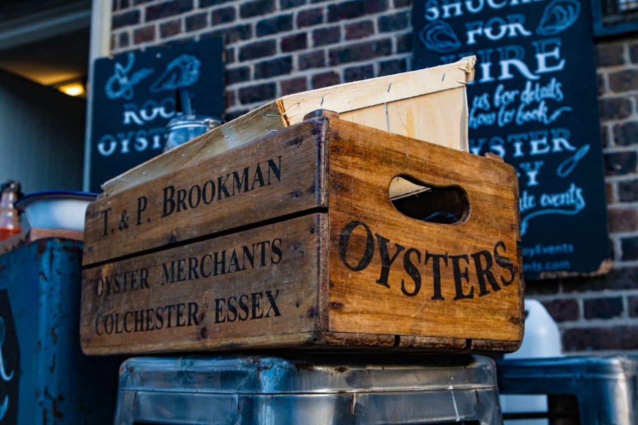 Oyster box outside on a metal stool for Wednesday's wine & Oysters event in Des Moines IA