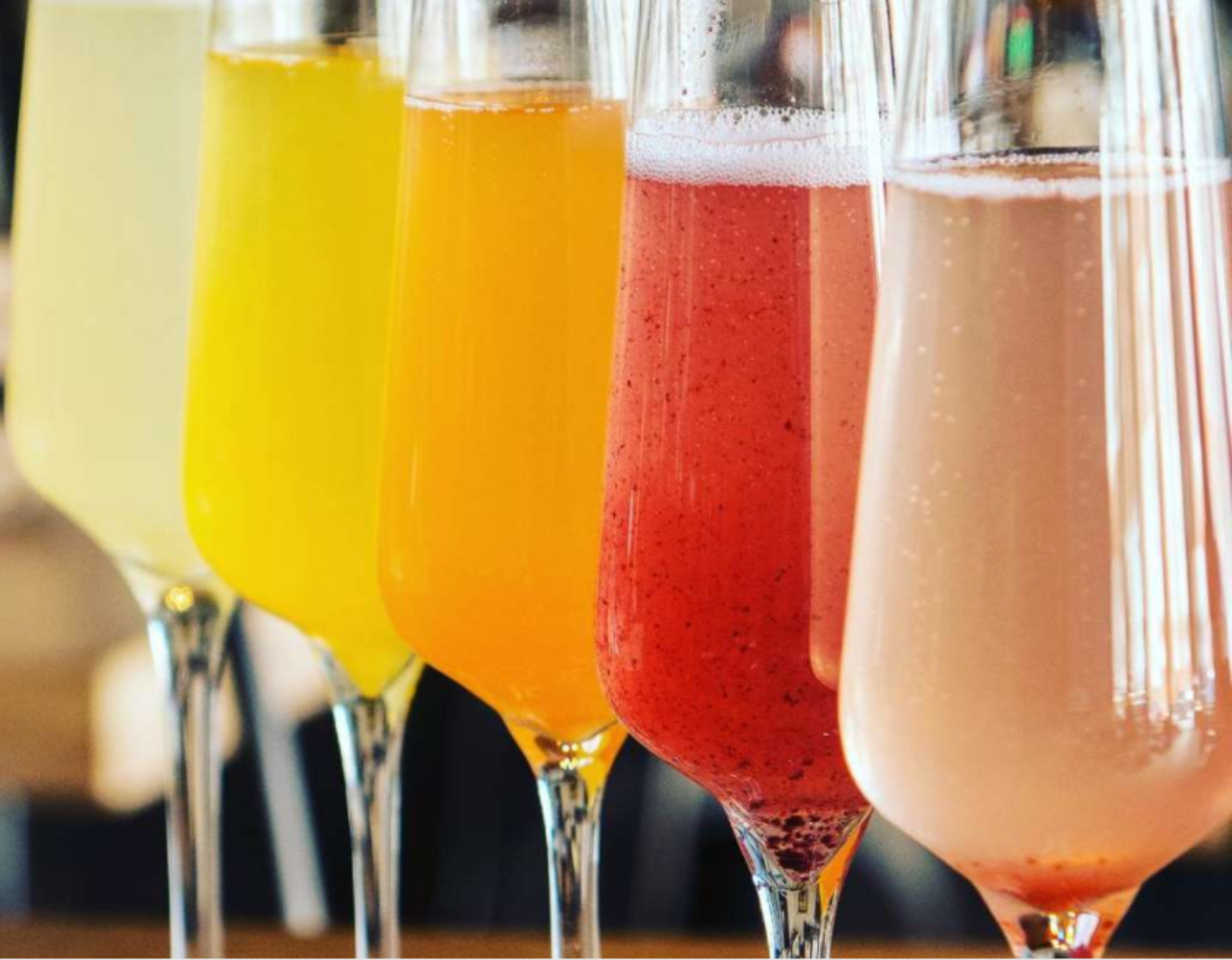 Five glasses of colorful Mimosas at our downtown hotel in Des Moines