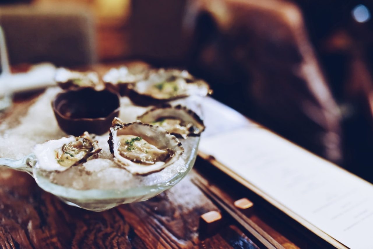 Open Oysters on ice on the bar at our restaurant in Des Moines IA