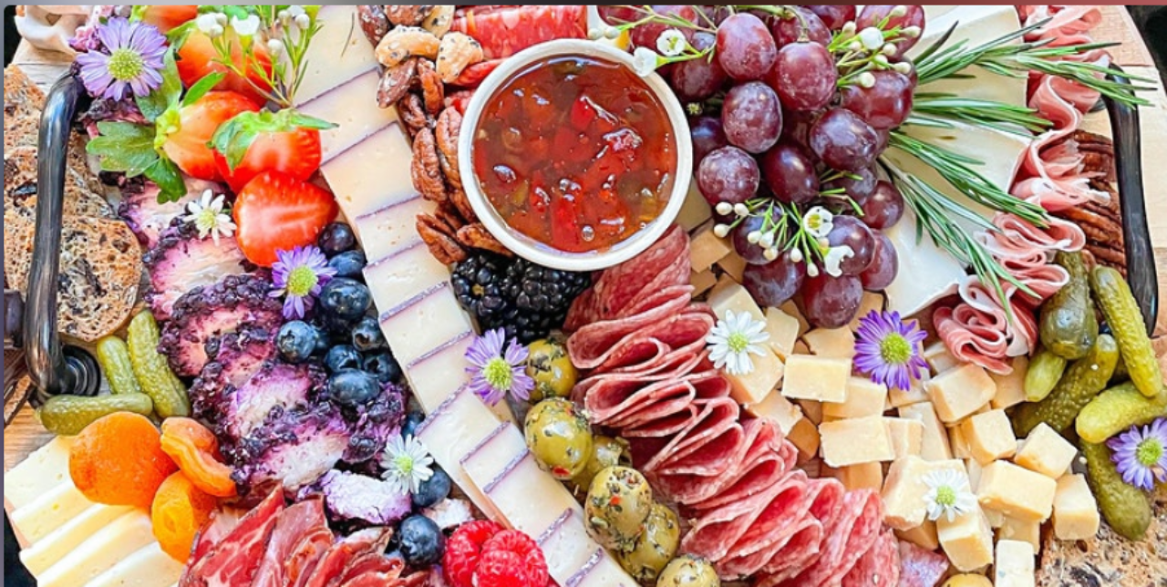 Vibrant charcuterie created by Kylie with berries, cheese and fruits for our Des Moines hotel guests