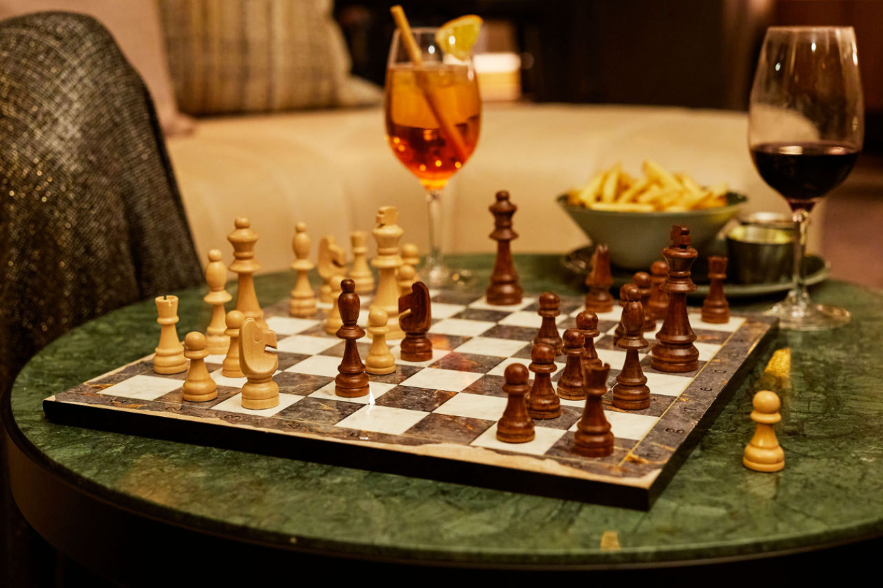 Wine glasses next to a chess board at our downtown Des Moines hotel
