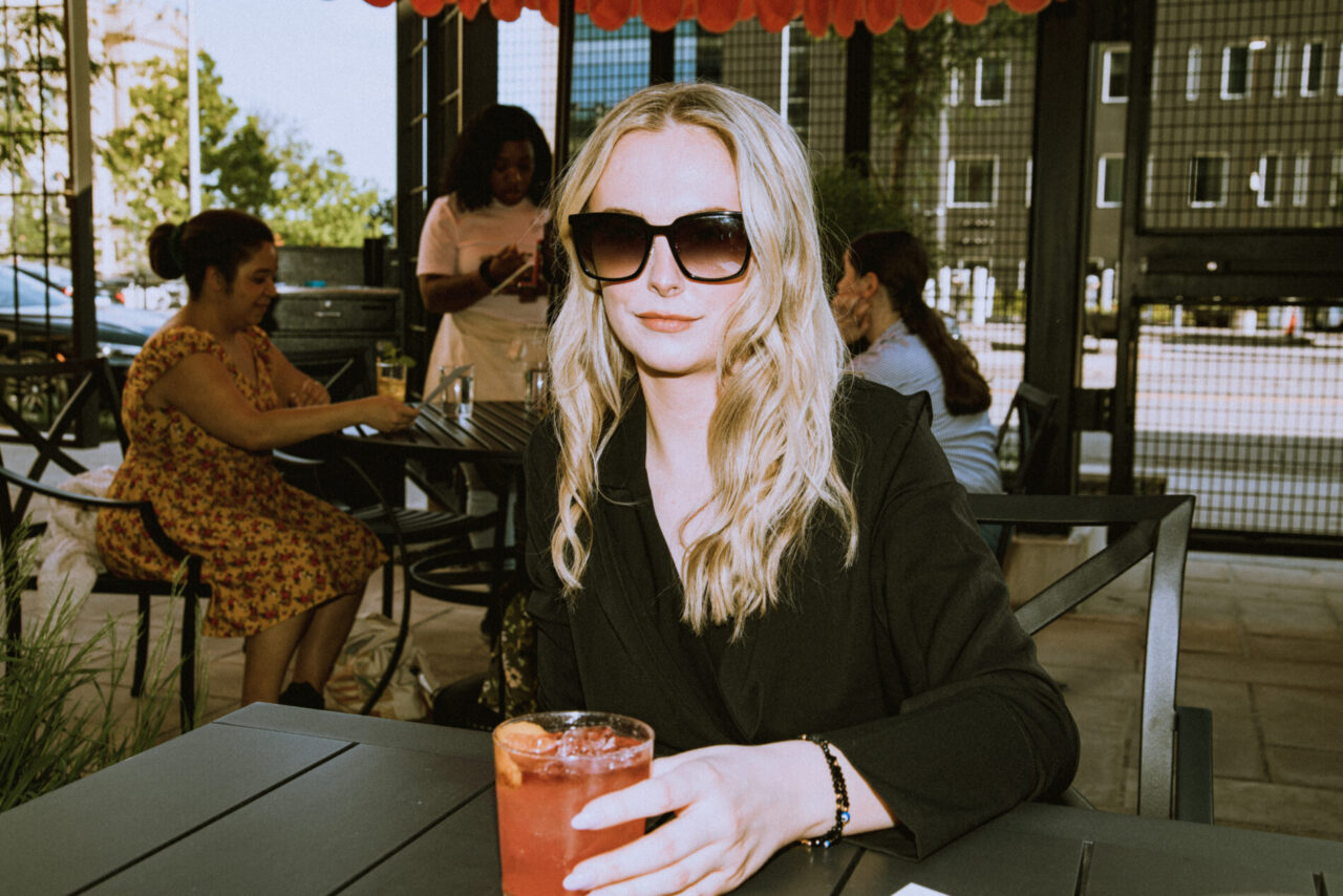 Person with drink at Surety Courtyard